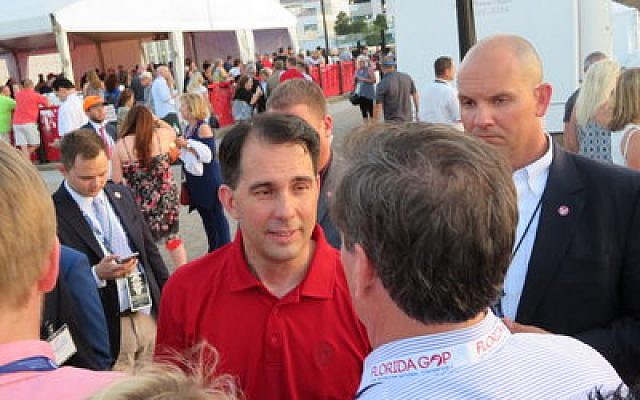 Wisconsin Gov. Scott Walker greets attendees at the opening bash of the Republican National Convention in Cleveland.

Photo by Ron Kampeas