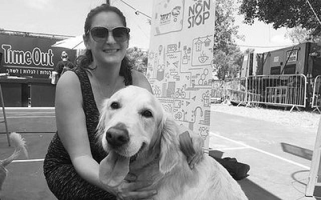 Mira Marcus, Tel Aviv’s director of international press, poses with her dog Shani at the Kelaviv dog festival. Photo by Andrew Tobin