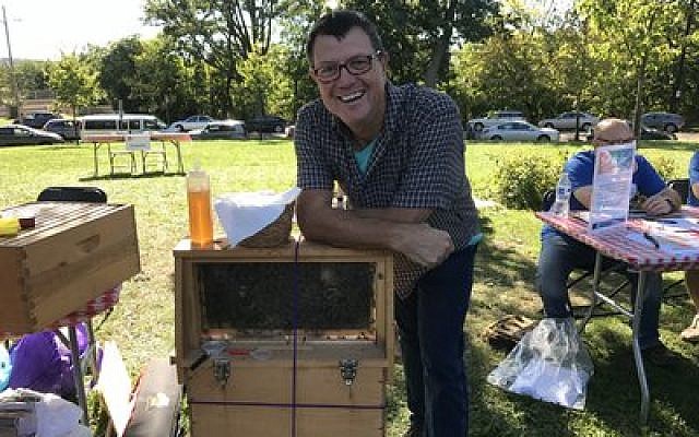 Steve Kroser is a local apiarist whose interest is in helping bees more than producing commercial honey. 
Photo by Jim Busis