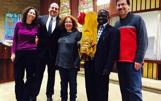Rabbis Amy and Alex Greenbaum (left), Francine Rosenthal, Rabbi Gershom Sizomu and President Cliff Spungen are all smiles for the Global Day of Jewish Learning after Beth El Congregation of the South Hills donated a Torah for use in Uganda.
Photo courtesy of Steve Hecht of Beth El Congregation of the South Hills
