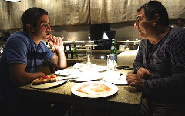 Michael Solomonov (left), star of a documentary about Israeli cuisine, is pictured with Haim Cohen, a chef, TV host, cookbook writer and restaurateur, in Tel Aviv-Jaffa. 
(Florentine Films)