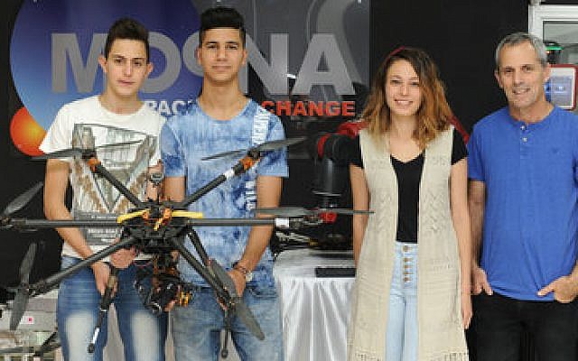 From left: Sharing first place are Ahmed Saba, 17, and Haled Abu Daud, 18, both Arab students from Majd al-Krum, who built an automatic fishing boat; second place was awarded to Rima Ali, 21, a Druze woman from Beit Jann who designed an interactive table. She is currently studying toward a bachelor’s degree in law and economics at the University of Haifa; also pictured is Asaf Brimer, CEO and founder of Moona.

(Photo courtesy of Karen Gold Anisfeld)