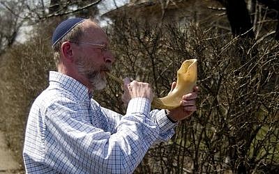 Dan Leger blew a shofar when Dor Hadash’s Torahs were walked to the Tree of Life building back in 2010. (Photo by Christopher Rolinson)