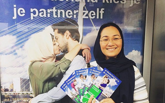 Shirin Musa hands out fliers in Rotterdam featuring images from the poster campaign on free choice of partners.
(Photo courtesy of Femme for Freedom)