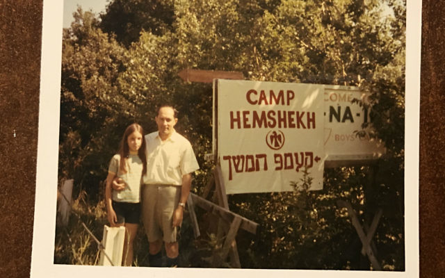 Helane Linzer and her father pose for a photoin 1969 in Mountaindale, N.Y., with the camp’s new sign.	Photo courtesy of Helane Linzer