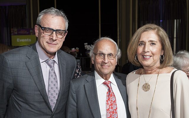 Dr. Steven D. Shapiro (left), UPMC chief medical and scientific officer, joins Grand Champion Dr. Arthur S. Levine, senior vice chancellor for Pitt's health sciences, and his wife, Linda Melada. (Photo courtesy of UPMC)