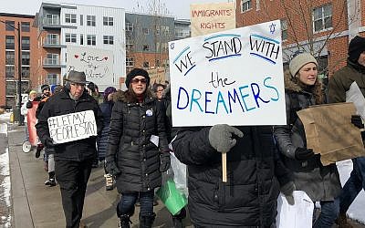 Protesters march with signs in support of Dreamers and a clean Dream Act at a Pittsburgh march in January. (Photo by Lauren Rosenblatt)