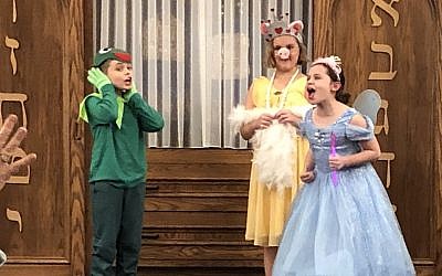 Adat Shalom Religious School students perform a Purim shpiel in 2018 entitled, “The Muppets Take Shushan,” directed by teacher Fran Conway. (Photo courtesy of Adat Shalom)