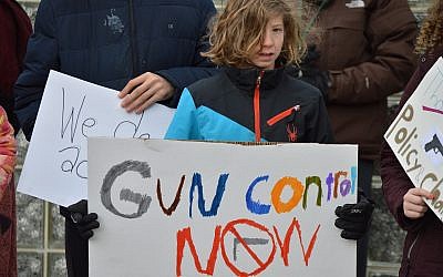 A student at Community Day School participates in the national walkout for gun reform in March 2018. (Photo courtesy of Community Day School)