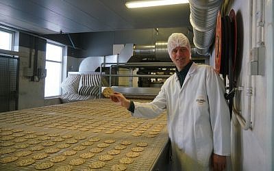 Pieter Heijs shows his product at his Hollandia Matzes factory in Enschede, the Netherlands, March 19, 2018. (Photo by Cnaan Liphshiz)