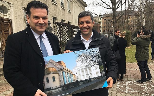 Raed Saleh, left, a Berlin senator, and the Berlin Jewish Community’s president, Gideon Joffe, hold an architect’s rendering of a planned reconstruction of the Fraenkelufer Synagogue. (Photo by Toby Axelrod)