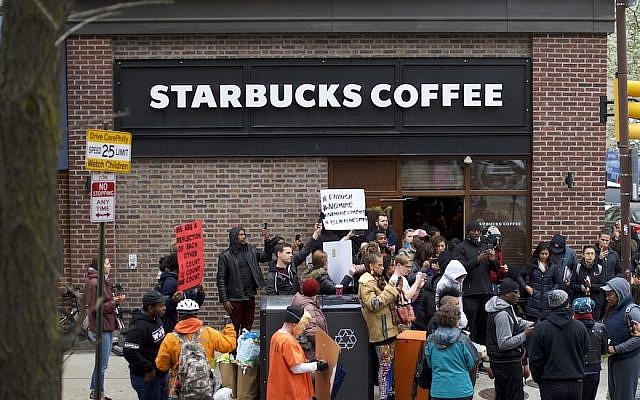 Protestors demonstrating outside a Starbucks in Philadelphia, April 15, 2018. (Photo by Mark Makela/Getty Images)