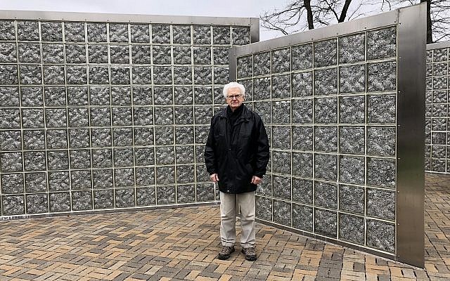 Albert Farhy, a Holocaust survivor who now lives in Pittsburgh, stands by the Gary and Nancy Tuckfelt Keeping Tabs sculpture at Community Day School. Farhy participated in the 2nd annual Walk to Remember on Sunday, April 29. (Photo by Lauren Rosenblatt)