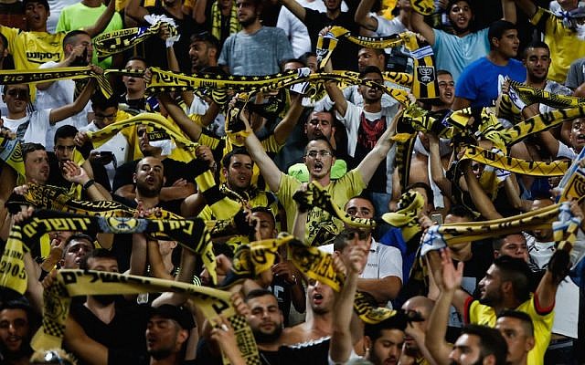 Beitar Jerusalem fans cheering at a match at Teddy Stadium in Jerusalem, July 23, 2015. (Photo by Yonatan Sindel/Flash90)