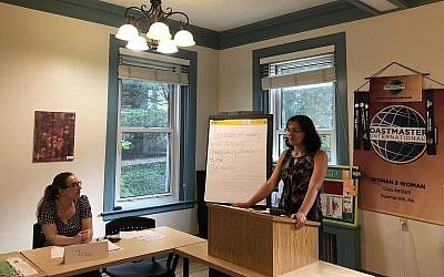 Daria Katson gives a speech on coaching skills during a Woman 2 Woman Toastmasters meeting. (Photo by Lauren Rosenblatt)