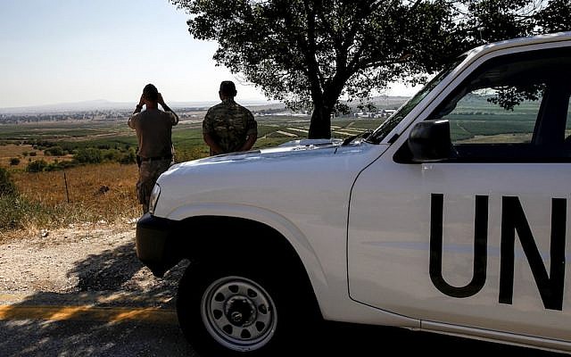U.N. peacekeepers looking out towards Syria from the Israeli-annexed Golan Heights, July 22, 2018. (Photo by Jalaa Marey/AFP/Getty Images)