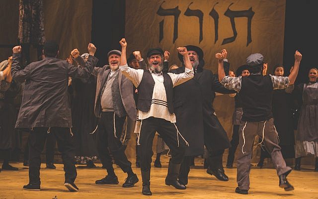 It isn’t the squishy “tradition” that Tevye, played by Steven Skybell, center, is upholding, it’s the Torah. (Photo by Victor Nechay/ProperPix)