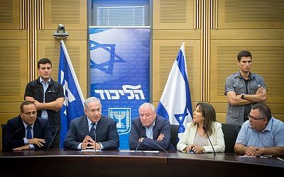 Prime Minister Benjamin Netanyahu, seated second from left, leads a Likud faction meeting in the Israeli parliament in Jerusalem in July. (Photo by Miriam Alster/Flash90)