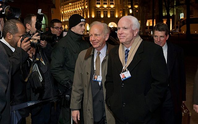 Sen. John McCain with Sen. Joseph 
Lieberman at the Munich Security 
Conference in Germany in 2014. (Photo by Joerg Koch/Getty Images)