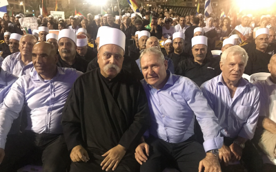 Amos Yadlin, third from left, sits with leaders of Israel’s Druze community at a Tel Aviv rally against the controversial nation-state law, Aug. 5, 2018. (Photo courtesy of Amos Yadlin)