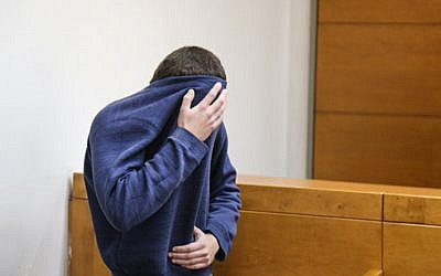 A man brought for a court hearing at the Rishon Lezion Magistrate's Court, under suspicion of Issuing fake bomb threats against Jewish institutions around the world, on March 23, 2017.  (Photo by Flash90)