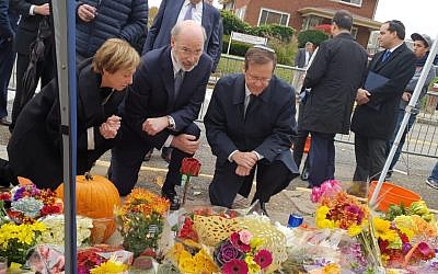 Isaac “Bougie” Herzog (right) is joined by Governor Tom Wolf and Cindy Shapira at the makeshift memorial outside of the Tree of Life building. (Courtesy photo)