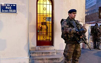 French soldiers patrol in front of a synagogue outside Paris as part of France’s national security alert system in 2015.(Photo by Kenzo Tribouillard/AFP/Getty Images)