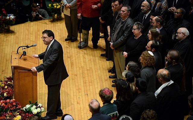 Rabbi Jonathan Perlman speaks to thousands at the Soldiers & Sailors Memorial Hall in Pittsburgh during a service to honor and mourn the victims of the mass shooting at the Tree Of Life synagogue building. (Photo by Jeff Swensen/Getty Images )