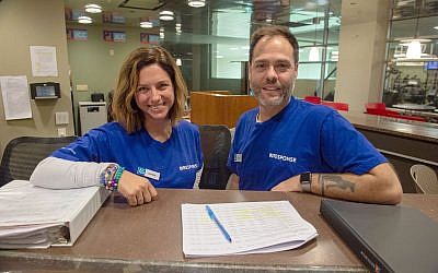 Lauren Dworkin (left) and Steve McGarr were among a group of JCC professionals who arrived in Pittsburgh as part of the JResponders program to relieve local employees who had been working tirelessly since Oct. 27.

Photo by Matt Unger/Jewish Community Center of Greater Pittsburgh