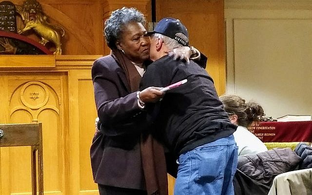 Polly Sheppard, a survivor of the Charleston church shooting, hugs Barry Werber, a survivor of the Pittsburgh synagogue shooting. Several members of the New Light delegation to Charleston met Sheppard when she was in Pittsburgh months ago. Photo by Adam Reinherz