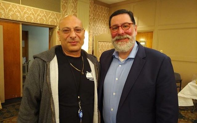 Dani Ohayon, one of 8 visiting Israeli vets, spoke with Mayor Bill Peduto at a May 5 event. 
Photo by Adam Reinherz