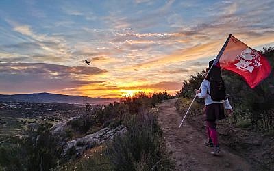 Monique Mead hiked to the top of a mountain in Tecate, Mexico on April 17 and played for 50 hikers at sunrise.  She carried the Beethoven flag and my gown to the top.  Photo by Osvaldo Nieto
