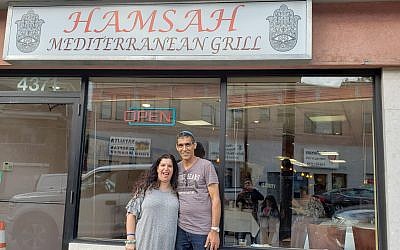 Sigalit and Nissim Assouline stand outside Hamsah Mediterranean Grill. Photo courtesy of Nissim Assouline