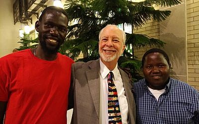 Yonatan Katz Kato, left, Rabbi Hazzan Jeffrey Myers and Wanani Esau finally meet after months of digital communication between the Pittsburgh and Ugandan communities. Photo by Adam Reinherz