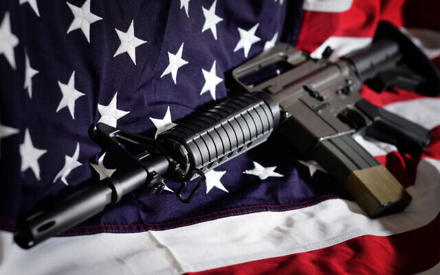 Flag of the USA with rifle Photo by artas/iStockphoto.com Flag of the USA with rifle Photo by artas/iStockphoto.com