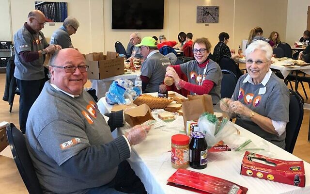 Volunteers from the South Hills Jewish community prepare items for food pantries on Mitzvah Day, 2017. (Photo provided by the Jewish Federation of Greater Pittsburgh)
