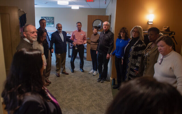 Community members gathered at the 10.27 Healing Partnership in February 2019 for a mezuzah hanging ceremony. The organization has announced its intention to continue until 2028. Photo courtesy of Maggie Feinstein