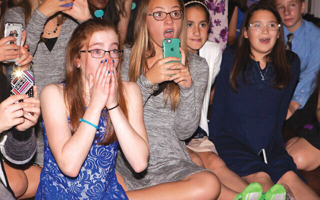 The big reveal: Jessica Daninhirsch sees that her bat mitzvah video is more than just a montage of her life.Photo by Amy Rodgers