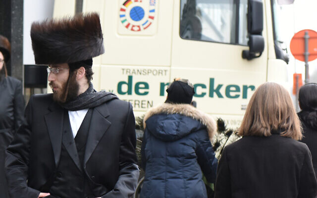 Haredi Orthodox Jews walk in Antwerp, Belgium, March 16, 2016. Photo by Cnaan Liphshiz Haredi Orthodox Jews walk in Antwerp, Belgium, March 16, 2016. Photo by Cnaan Liphshiz