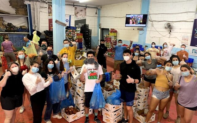 Year Course students this spring wear masks while volunteering.
Photo courtesy of Year Course Year Course students this spring wear masks while volunteering.
Photo courtesy of Year Course