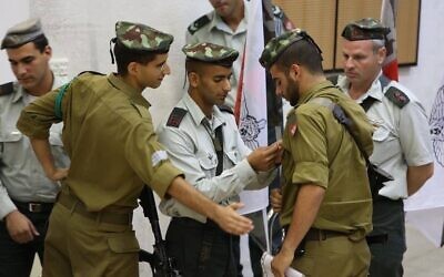 Yitzy Nadoff receives the Combat Medic Pin while serving in the IDF. (Photo provided by Yitzy Nadoff)