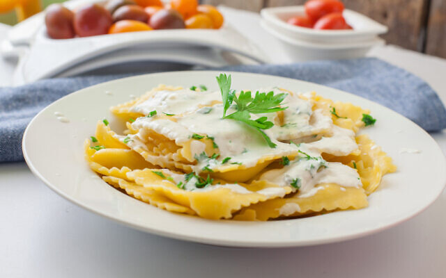 Homemade italian ravioli with sauce and parsley. Photo by trexec/iStockphoto.com