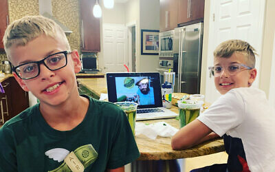 Judah and Ari Paris participate in Chabad's recent pickling workshop. Photo courtesy of Julie Paris