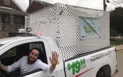Rabbi Yitzi Goldwasser in his sukkahmobile  (Photo provided by Rabbi Yitzi Goldwasser)