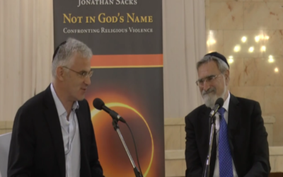 Daniel Taub (left) interviewing Rabbi Lord Jonathan Sacks (Photo via jewishnews.timesofisrael.com)