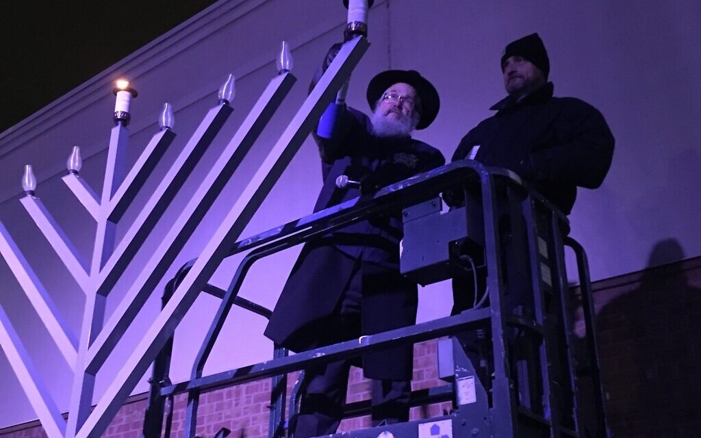 Pittsburgh's Rabbi Yisroel Rosenfeld lights the menorah at 2020's Chanukah celebration at the Waterfront. (Photo provided by Rabbi Yisroel Altein)