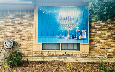 A festive Hanukkah banner (Hannah Lebovits via JTA)