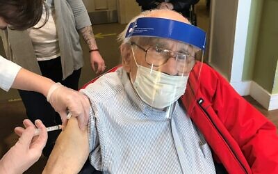 JAA resident Larry receives the Pfizer vaccine. Photo courtesy of Jewish Association on Aging