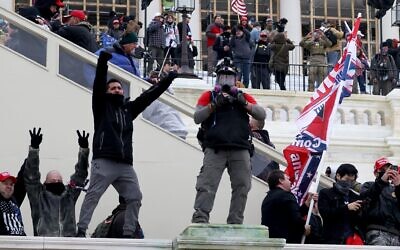 Protesters gather on the U.S. Capitol Building in Washington, D.C. on Jan. 6, 2021. Pro-Trump protesters entered the U.S. Capitol building after mass demonstrations in the nation's capital during a joint session Congress to ratify President-elect Joe Biden's 306-232 Electoral College win over President Donald Trump. (Tasos Katopodis/Getty Images via JTA)