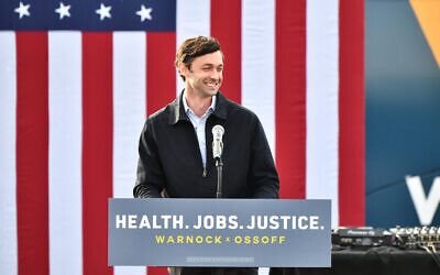 Jon Ossoff speaks onstage during the "Vote GA Blue" concert for Georgia Democratic Senate candidates Raphael Warnock and Jon Ossoff on Dec. 28, 2020 in Stonecrest, Georgia. (Photo by Paras Griffin/Getty Images via JTA)